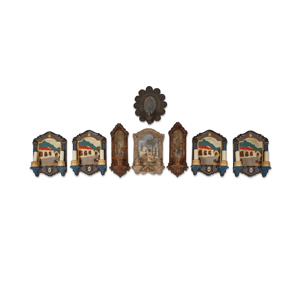 A GROUP OF CERAMIC LUMINAIRES: A GROUP OF CERAMIC LUMINAIRES California Mission-themed, electrified, together with a tin mirrored sconce. (8) the largest height 15in; width 6in This lot is subject to the following lot symbols: