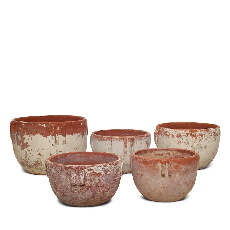 A GROUP OF BAUER POTTERY TERRACOTTA GLAZED 'INDIAN' POTSLos Angeles, 20th century: A GROUP OF BAUER POTTERY TERRACOTTA GLAZED 'INDIAN' POTS Los Angeles, 20th century Of varying sizes, arranged by height. (5) height of tallest 14 1/4in; diameter 20 1/2in Footnotes: From Diane