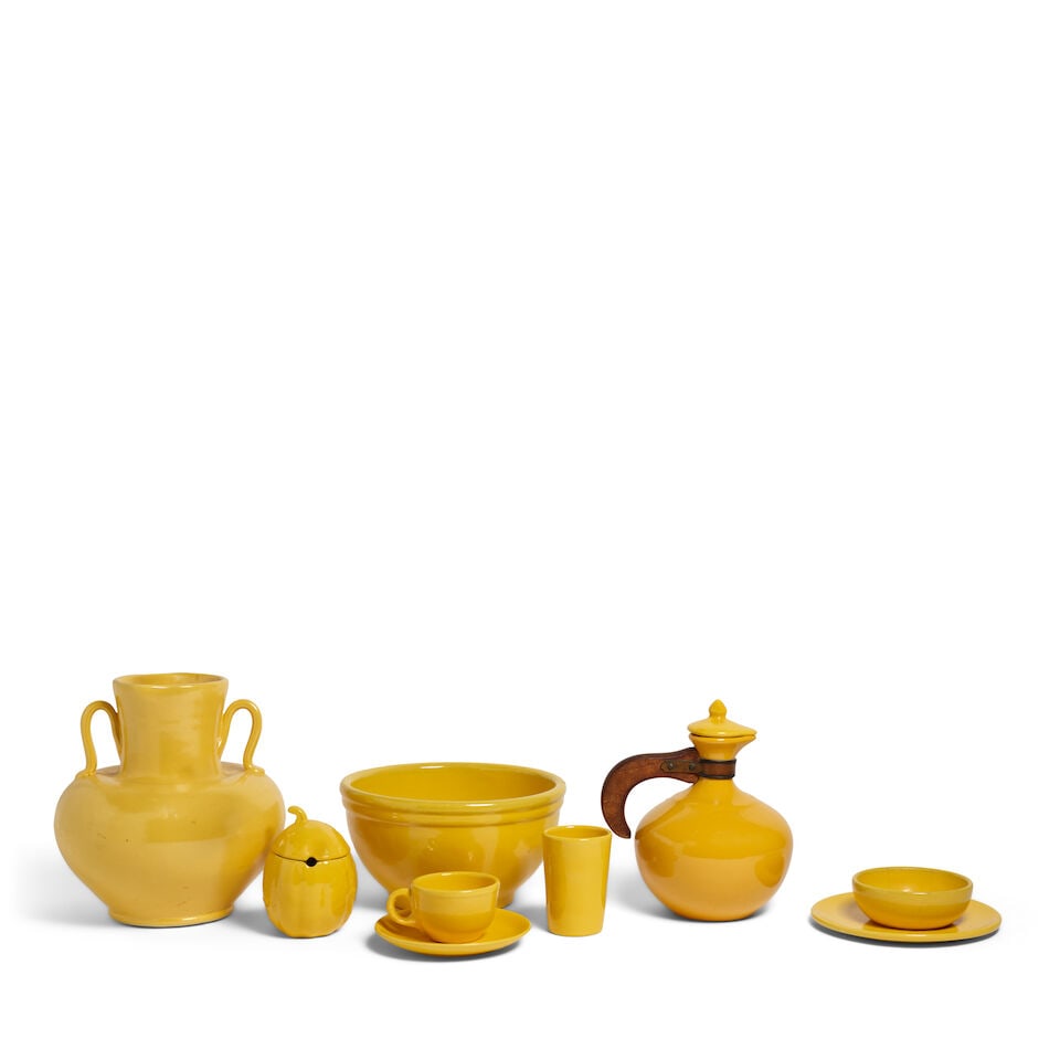 A GROUP OF CATALINA ISLAND POTTERY YELLOW GLAZED TABLE DECORATIONS20th century: A GROUP OF CATALINA ISLAND POTTERY YELLOW GLAZED TABLE DECORATIONS 20th century Including pitchers, bowls, and plates, together with similar yellow glazed ceramic dinnerware. (30) height of largest