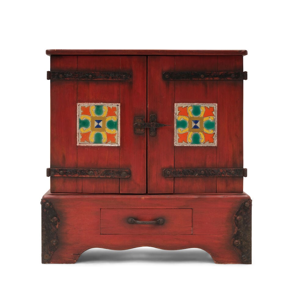 A MONTEREY STYLE IRON MOUNTED TILE INSET OLD RED STAINED RADIO CABINET1920s: A MONTEREY STYLE IRON MOUNTED TILE INSET OLD RED STAINED RADIO CABINET 1920s With branded A in circle. height 32 1/2in; width 30 3/4in; depth 16 1/4in This lot is subject to the following lot