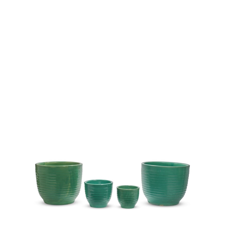 FOUR BAUER POTTERY JADE GREEN GLAZED RINGWEAR CERAMIC PLANTERSLos Angeles, circa 1930-1950: FOUR BAUER POTTERY JADE GREEN GLAZED RINGWEAR CERAMIC PLANTERS Los Angeles, circa 1930-1950 Two impressed 10, one 5. height of largest 10 1/2in; diameter 11 1/4in Footnotes: From Diane Keaton's