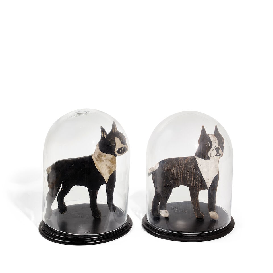 TWO PAINTED WOOD DOGS IN GLASS DOMES20th century: TWO PAINTED WOOD DOGS IN GLASS DOMES 20th century overall height of each approximately 17in Footnotes: From Diane Keaton's bedroom in her Sullivan Canyon home. This lot is subject to the following