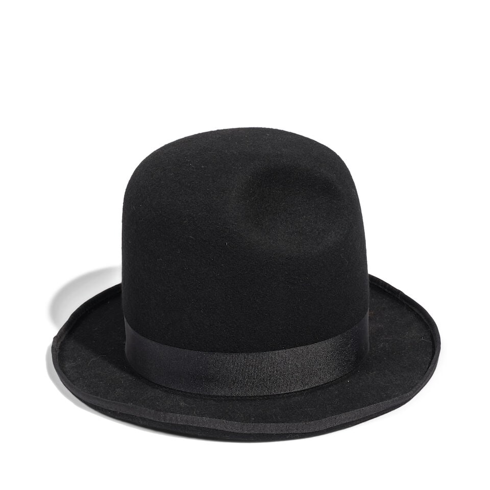 A DIEGO GUARNIZO & MARIA LOUISA ORTIZ BLACK FELT NEOGRANADINE CUP HAT WITH RIBBON: A DIEGO GUARNIZO & MARIA LOUISA ORTIZ BLACK FELT NEOGRANADINE CUP HAT WITH RIBBON Marked size 5 1/2 / 58. Footnotes: Worn for the Bolivar Series by InStyle magazine in 2018, shot by Ruven Afanador.