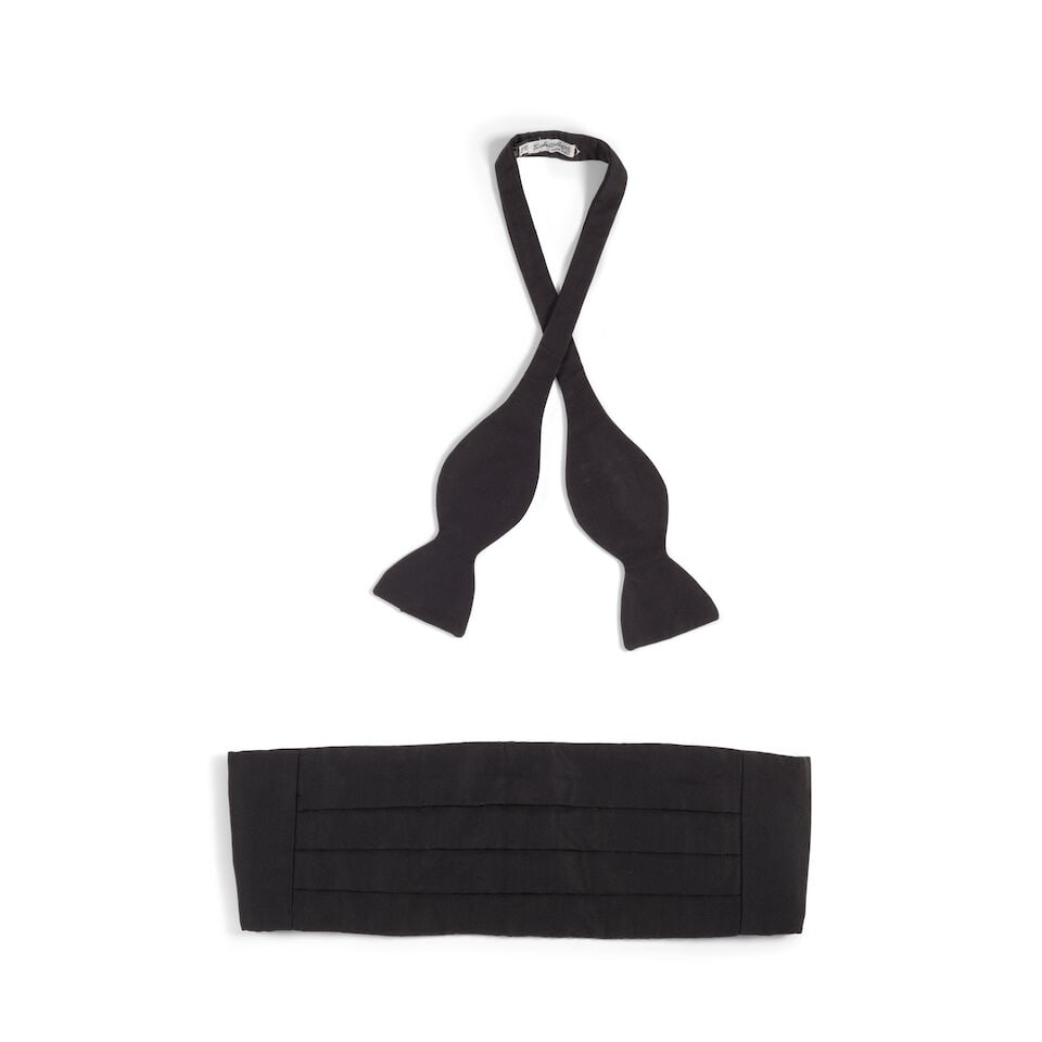 A TURNBULL AND ASSER LTD BLACK SILK CUMBERBUND AND BOWTIE: A TURNBULL AND ASSER LTD BLACK SILK CUMBERBUND AND BOWTIE Bowtie marked size 15 1/2in. This lot is subject to the following lot symbols: ¤ ¤ Unless indicated by the ¤ symbol next to