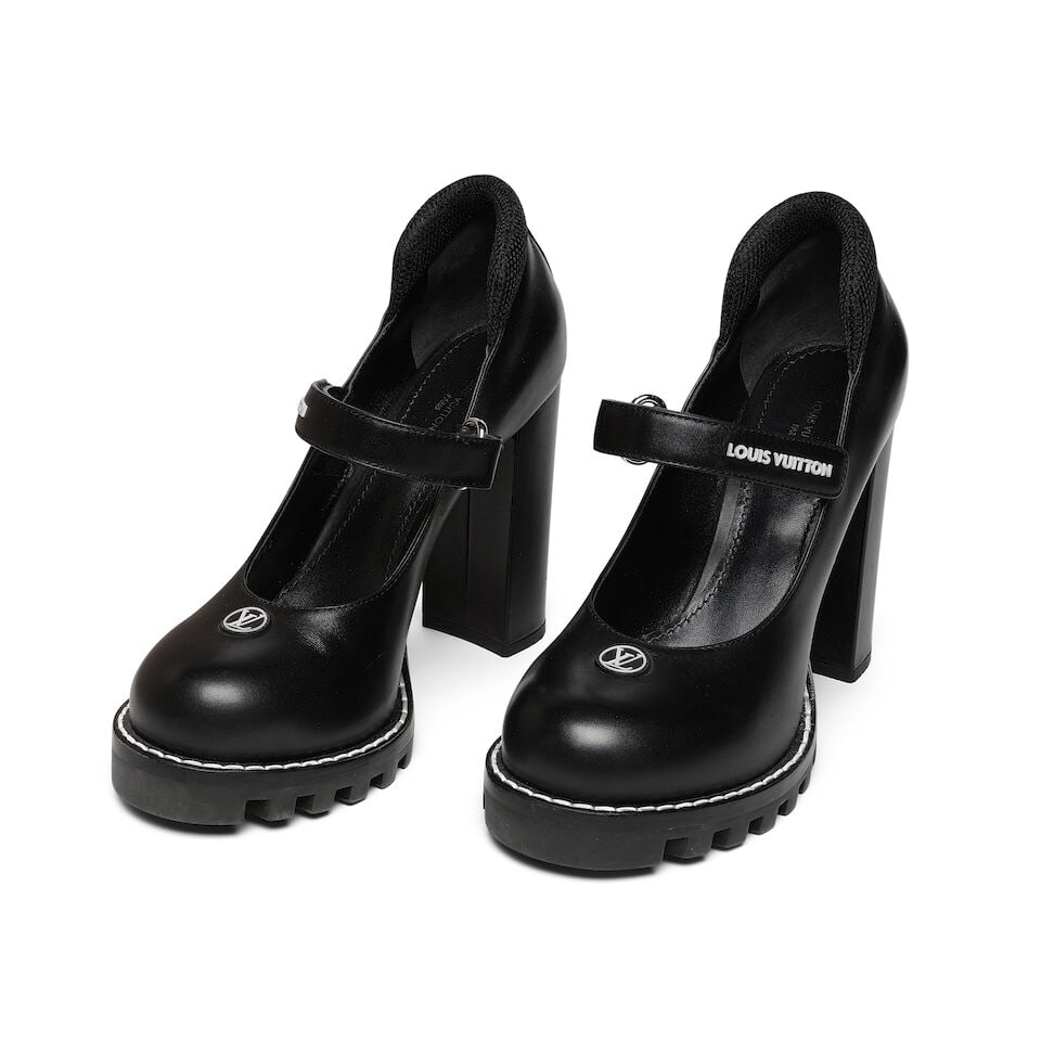 A PAIR OF LOUIS VUITTON BLACK CALFSKIN STAR TRAIL ANKLE PUMPS: A PAIR OF LOUIS VUITTON BLACK CALFSKIN STAR TRAIL ANKLE PUMPS Marked size 41, in the original Louis Vuitton box. Footnotes: Literature Keaton, Diane. Fashion First. Rizzoli, New York, 2024. Worn on