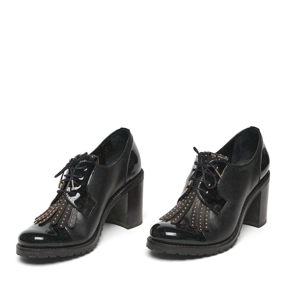 A PAIR OF THE OFFICE OF ANGELA SCOTT BRASS STUDDED BLACK LEATHER MRS. ROBINSON OXFORD: A PAIR OF THE OFFICE OF ANGELA SCOTT BRASS STUDDED BLACK LEATHER MRS. ROBINSON OXFORD Marked size 42. Footnotes: Literature Keaton, Diane. Fashion First. Rizzoli, New York, 2024. This lot is subject