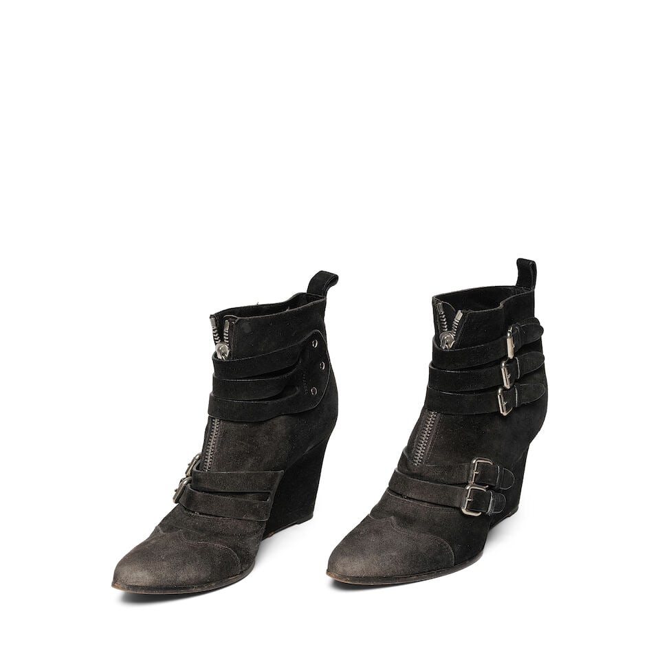 A PAIR OF TABITHA SIMMONS SILVER BUCKLED BLACK SUEDE 'HARLEY' WEDGE ANKLE BOOTS: A PAIR OF TABITHA SIMMONS SILVER BUCKLED BLACK SUEDE 'HARLEY' WEDGE ANKLE BOOTS Marked size 40 1/2. This lot is subject to the following lot symbols: ¤ ¤ Unless indicated by the ¤