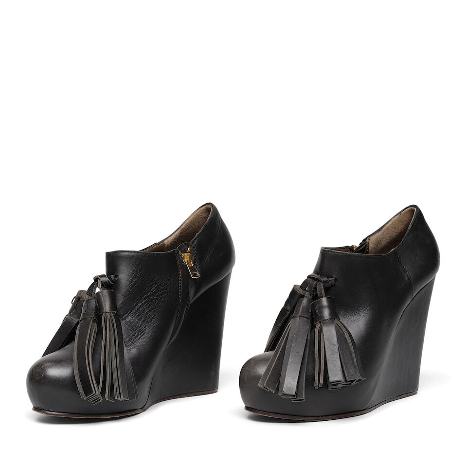 A PAIR OF MARNI BLACK LEATHER TASSEL WEDGE ANKLE BOOTS: A PAIR OF MARNI BLACK LEATHER TASSEL WEDGE ANKLE BOOTS Marked size 41. Footnotes: Worn by Diane Keaton at the L'Oreal Paris' Women of Worth event, The Pierre Hotel, New York City, 03 December