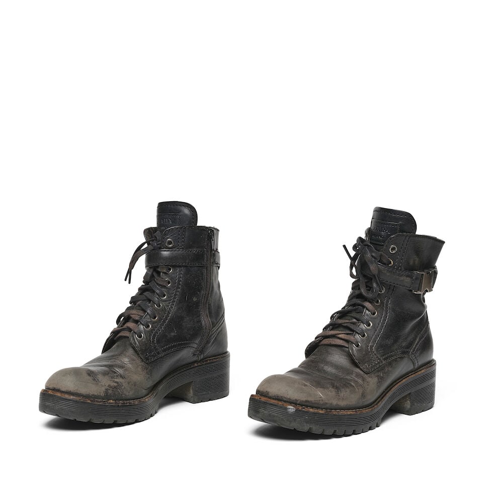 A PAIR OF PRADA BLACK LEATHER SPORT MID-CALF COMBAT BOOTS (1 of 2)