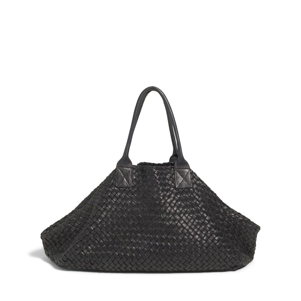 A BOTTEGA VENETA BLACK LEATHER WOVEN TOTE BAGE: A BOTTEGA VENETA BLACK LEATHER WOVEN TOTE BAGE With an attached black leather zippered pouch. height 14in; width 26 1/4in; should drop 8in This lot is subject to the following lot symbols: