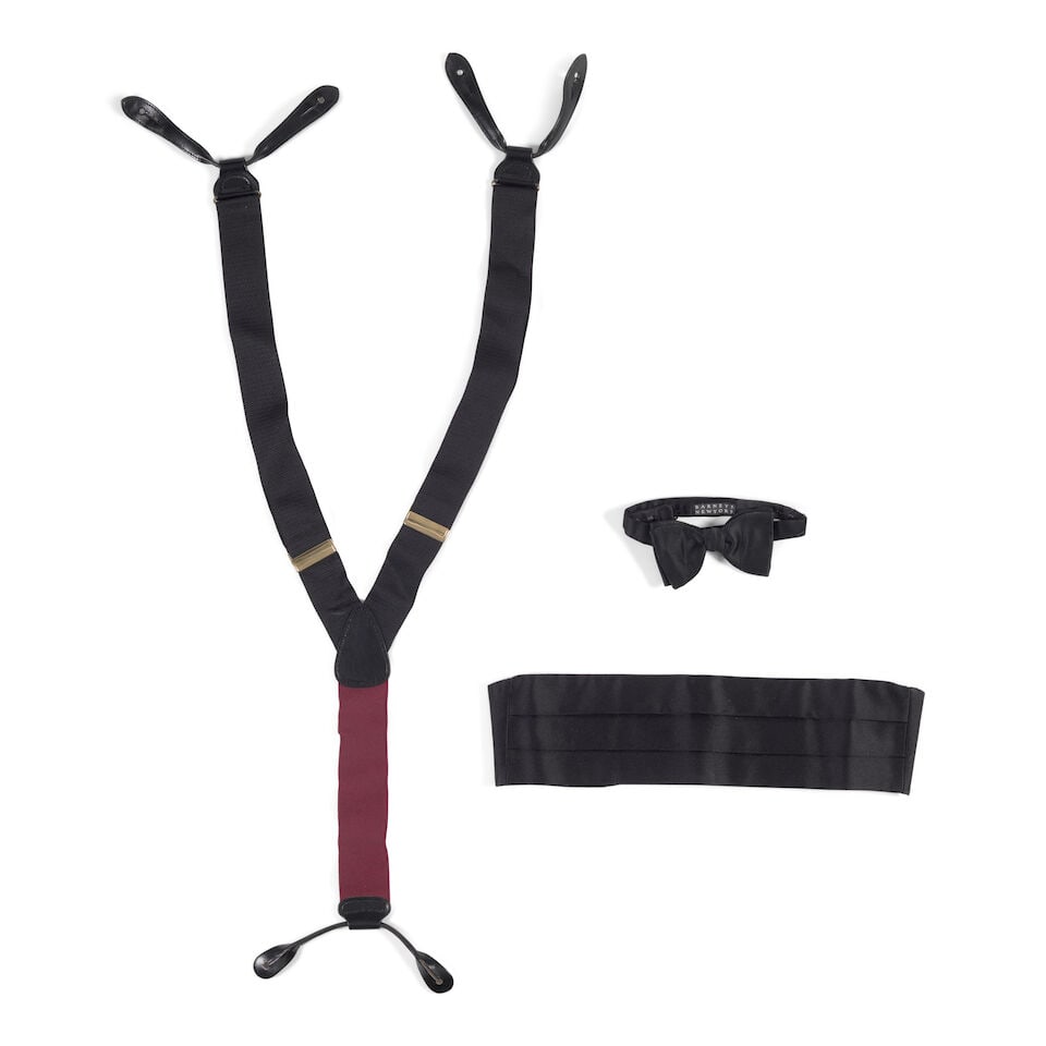 A GROUP OF EVENING MENSWARE ACCESSORIES: A GROUP OF EVENING MENSWARE ACCESSORIES Comprising one pair of black suspenders, one Ralph Lauren Purple Label black silk cummerbund with a piece of tape inscribed Diane, and one Barneys black silk