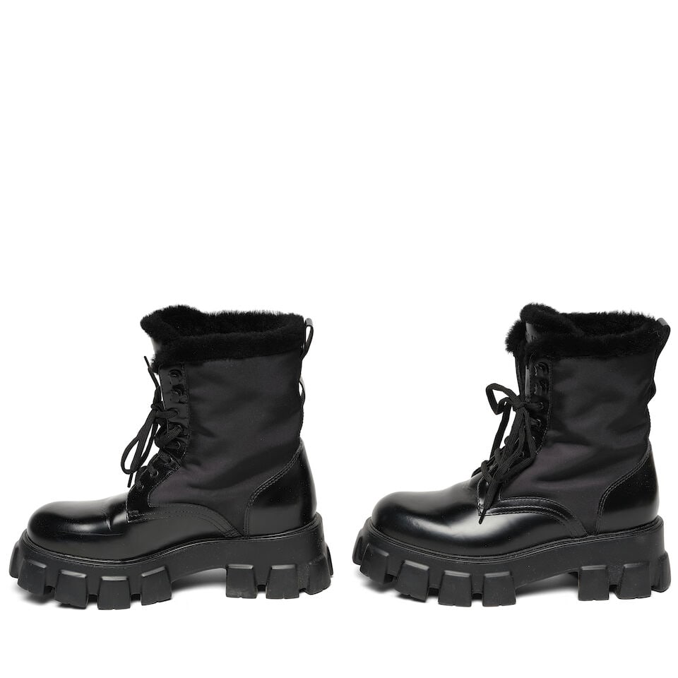 A PAIR OF PRADA BLACK FUR TRIMMED BRUSHED LEATHER 'MONOLITH' COMBAT BOOTS - 2