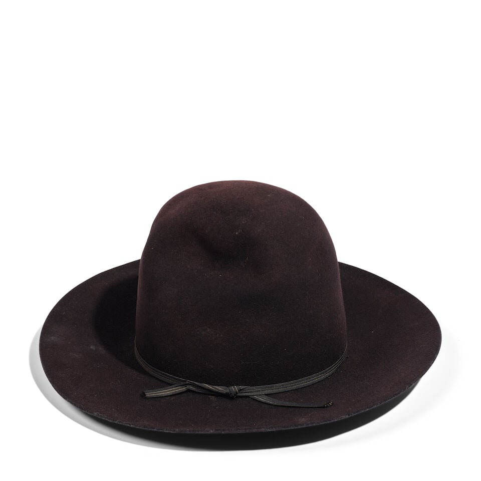 A BARON TALL BLACK HAT WITH BLACK RIBBON: A BARON TALL BLACK HAT WITH BLACK RIBBON No marked size. interior 8 x 6 7/8in Footnotes: Worn by Diane Keaton at the Mack & Rita premiere, NeueHouse, Los Angeles, 10 August 2022. This lot is subject t