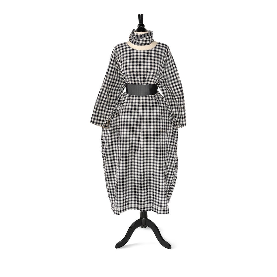 A LINEN GINGHAM SACK DRESS AND MATCHING SCARF: A LINEN GINGHAM SACK DRESS AND MATCHING SCARF No marked brand or size, together with a black petticoat. (3) shoulders approximately 15in Please note, this look was styled with a black ribbon in lieu