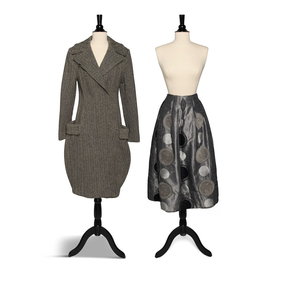 A SUSAN BECKER HERRINGBONE WOOL COAT AND A GREY RAW SILK POLKA DOT SKIRT: A SUSAN BECKER HERRINGBONE WOOL COAT AND A GREY RAW SILK POLKA DOT SKIRT No marked sizes; together with a white petticoat. shoulders of coat approximately 16 1/2in; skirt waist 28in Footnotes: Susan