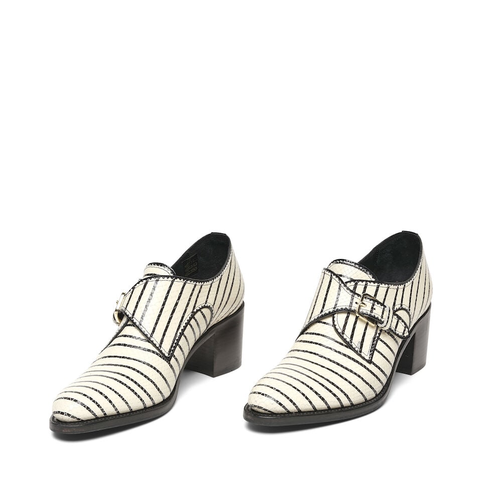 A PAIR OF THE OFFICE OF ANGELA SCOTT WHITE LEATHER 'STRIPES' BUCKLE STRAP MID HEEL SHOES: A PAIR OF THE OFFICE OF ANGELA SCOTT WHITE LEATHER 'STRIPES' BUCKLE STRAP MID HEEL SHOES Goodyear welted, marked size 41. Footnotes: Literature Keaton, Diane. Fashion First. Rizzoli, New York, 2024. T