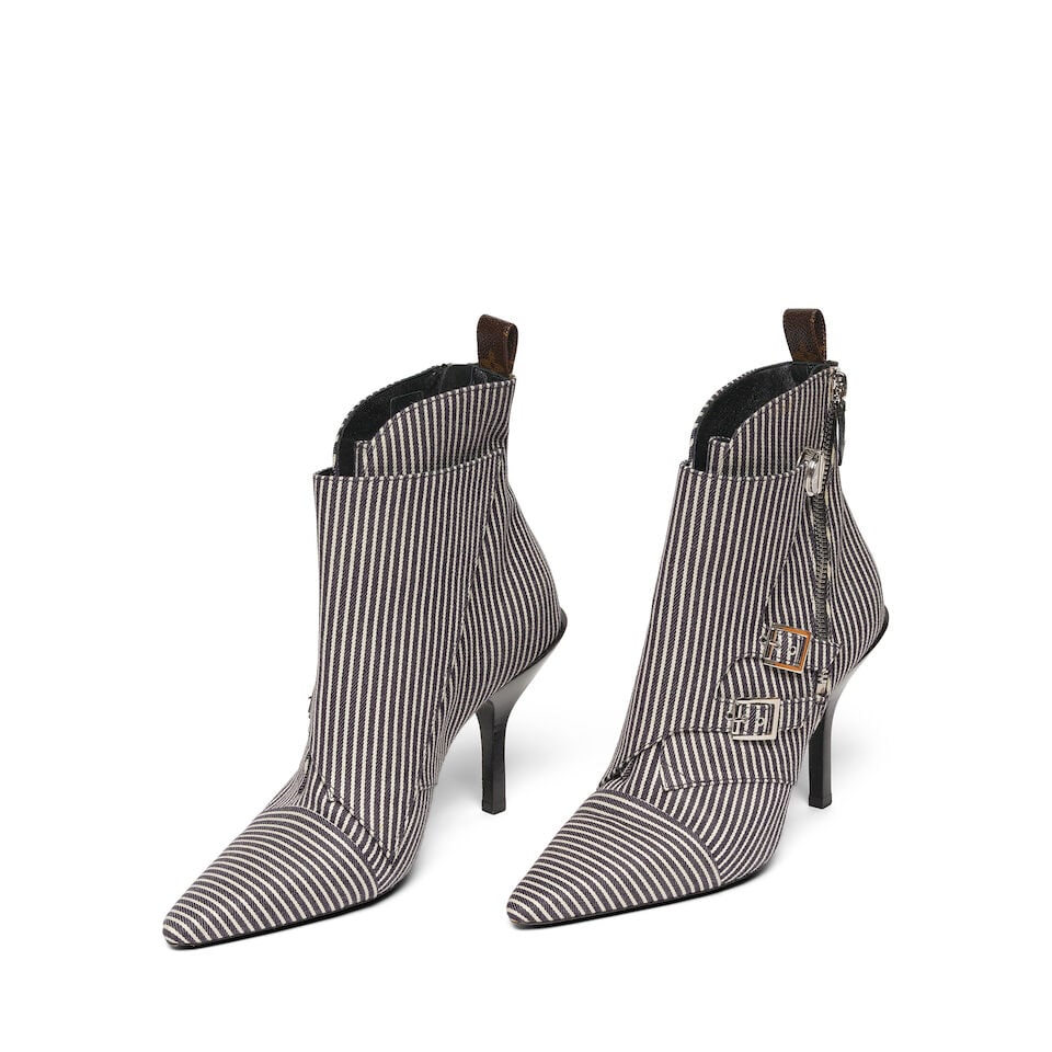 A PAIR OF LOUIS VUITTON STRIPED CANVAS JANET ANKLE BOOTSpring/Summer 2019: A PAIR OF LOUIS VUITTON STRIPED CANVAS JANET ANKLE BOOT Spring/Summer 2019 Marked size 41. Footnotes: Worn by Diane Keaton at the Poms press conference, Four Seasons Hotel, Beverly Hills, 02 May 2019.