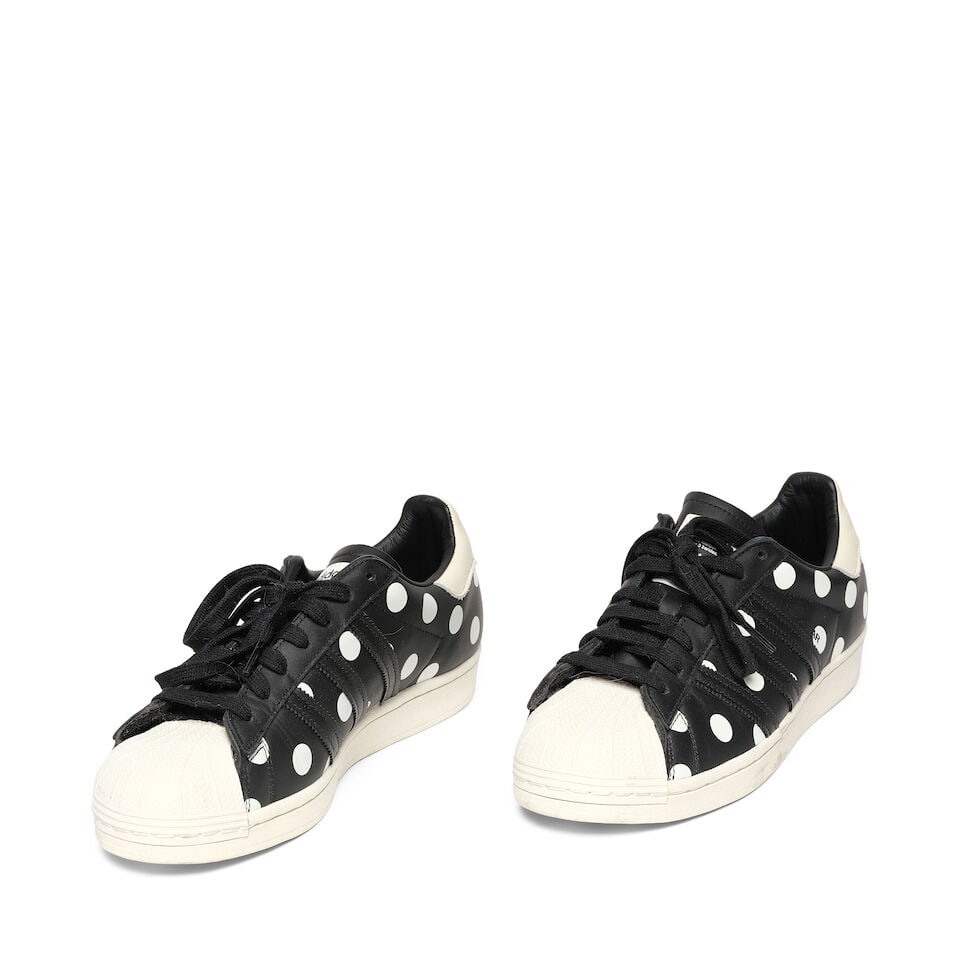 A PAIR OF ADIDAS BLACK AND WHITE LEATHER POLKA DOT SUPERSTAR SNEAKERSFall 2020: A PAIR OF ADIDAS BLACK AND WHITE LEATHER POLKA DOT SUPERSTAR SNEAKERS Fall 2020 Marked size 10. This lot is subject to the following lot symbols: ¤ ¤ Unless indicated by the ¤ symbol ne