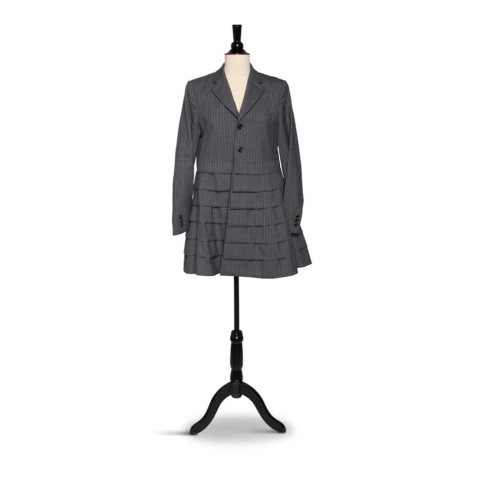 A COMME DES GARÇONS GRAY VERTICAL STRIPED PLEATED BUTTON-DOWN MANDARIN COLLAR WOOL COAT JACKET: A COMME DES GARÇONS GRAY VERTICAL STRIPED PLEATED BUTTON-DOWN MANDARIN COLLAR WOOL COAT JACKET Marked size S. Footnotes: Featured on @diane_keaton Instagram 10 March 2019 and 19 July 2019. This l