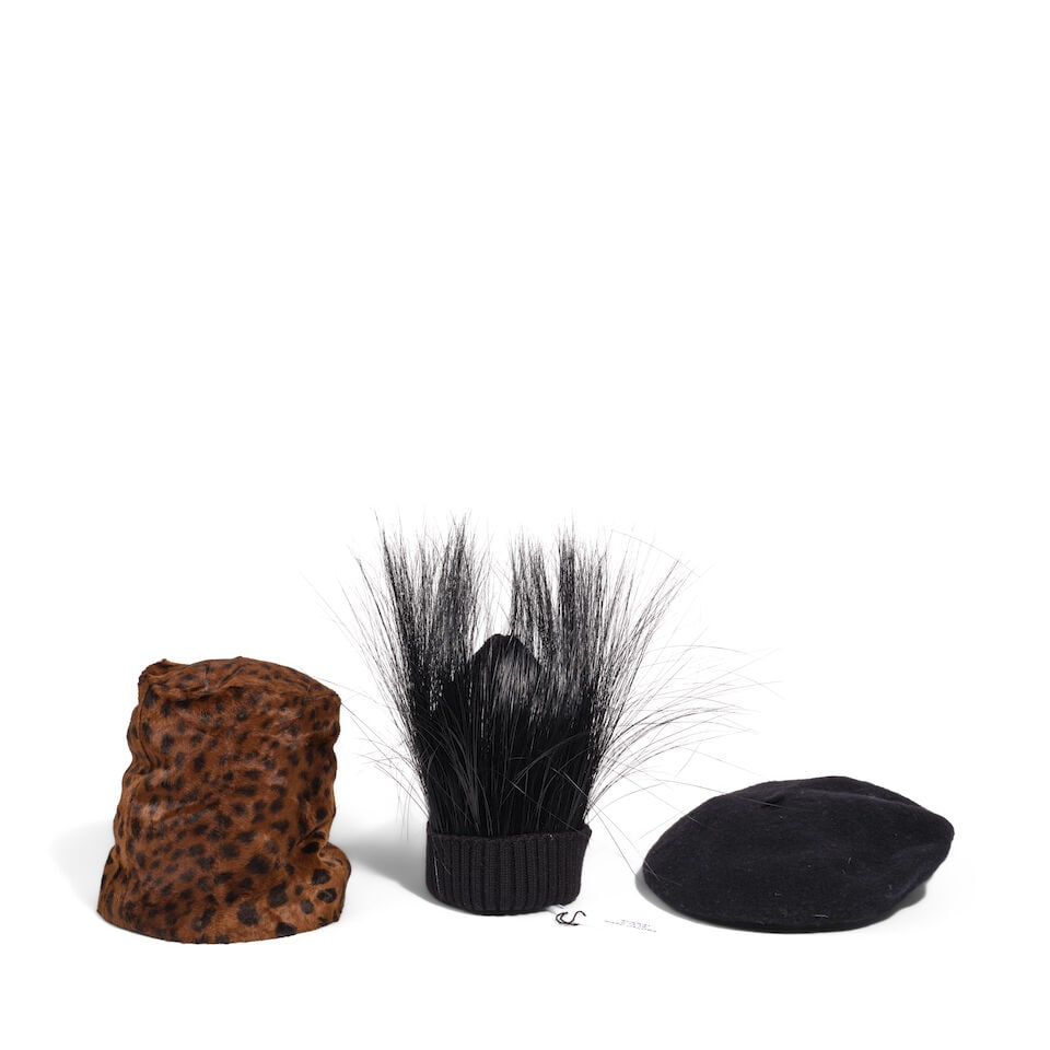 THREE CAPS: THREE CAPS Comprising a wool beret with a leather trim marked size large, a Marc Jacobs x Stephen Jones wool beanie with black peacock feathers from the 2.13.19 Marc Jacons Runway marked one size, and