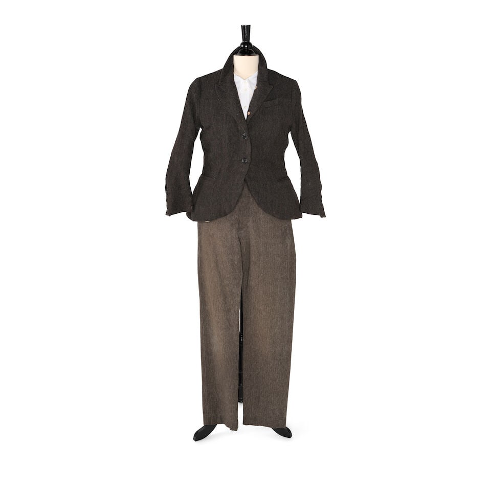 A PAUL HARNDEN SHOEMAKERS A BROWN TWEED JACKET AND A PAIR OF SAILCLOTH PANTS: A PAUL HARNDEN SHOEMAKERS A BROWN TWEED JACKET AND A PAIR OF SAILCLOTH PANTS The wool, linen, cotton blend single-breasted jacket marked size L and the pair of sail cloth pants marked size 31 x 32;