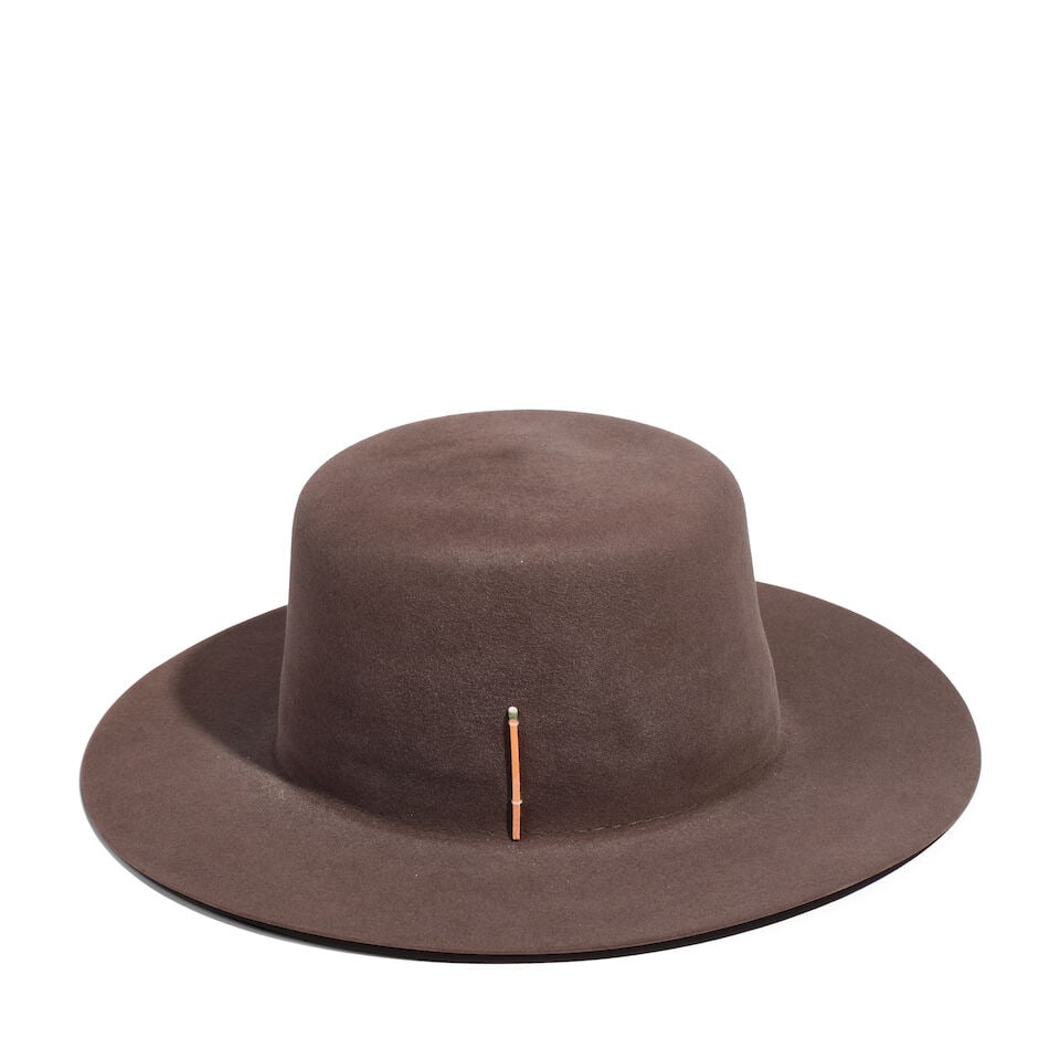 A NICK FOUQUET GRAY FELT FLAT BRIM HAT WITH MATCHSTICK: A NICK FOUQUET GRAY FELT FLAT BRIM HAT WITH MATCHSTICK No marked size. interior 8 x 6 1/4in Footnotes: Featured on diane_keaton Instagram on 7 July 2020. This lot is subject to the following lot symbo