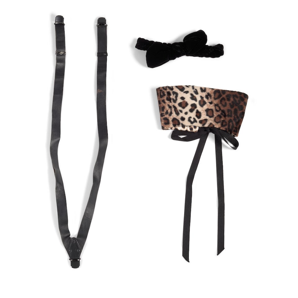 A GROUP OF FASHION ACCESSORIES: A GROUP OF FASHION ACCESSORIES Comprising a pair of Alai black leather suspenders, a black velvet headband, and a leopard print reversable collar. (3) Footnotes: The black velvet headband worn as a ti