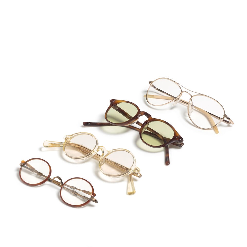 FOUR PAIRS OF OLIVER PEOPLES EYEGLASSES: FOUR PAIRS OF OLIVER PEOPLES EYEGLASSES Comprising a gold-tone rim Aero example, a prescription 'Beau' example in champagne from the brand's Twenty Years anniversary collection, a prescription