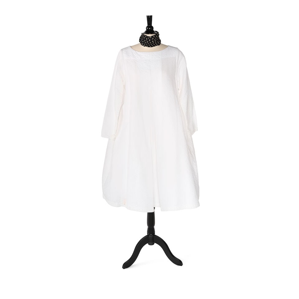 A WHITE QUILTED DRESS WITH A BLACK AND WHITE POLKA DOT SCARF: A WHITE QUILTED DRESS WITH A BLACK AND WHITE POLKA DOT SCARF No marked sizes or brands, together with a Grace Karin white petticoat. (3) shoulders approximately 14 1/2in; length