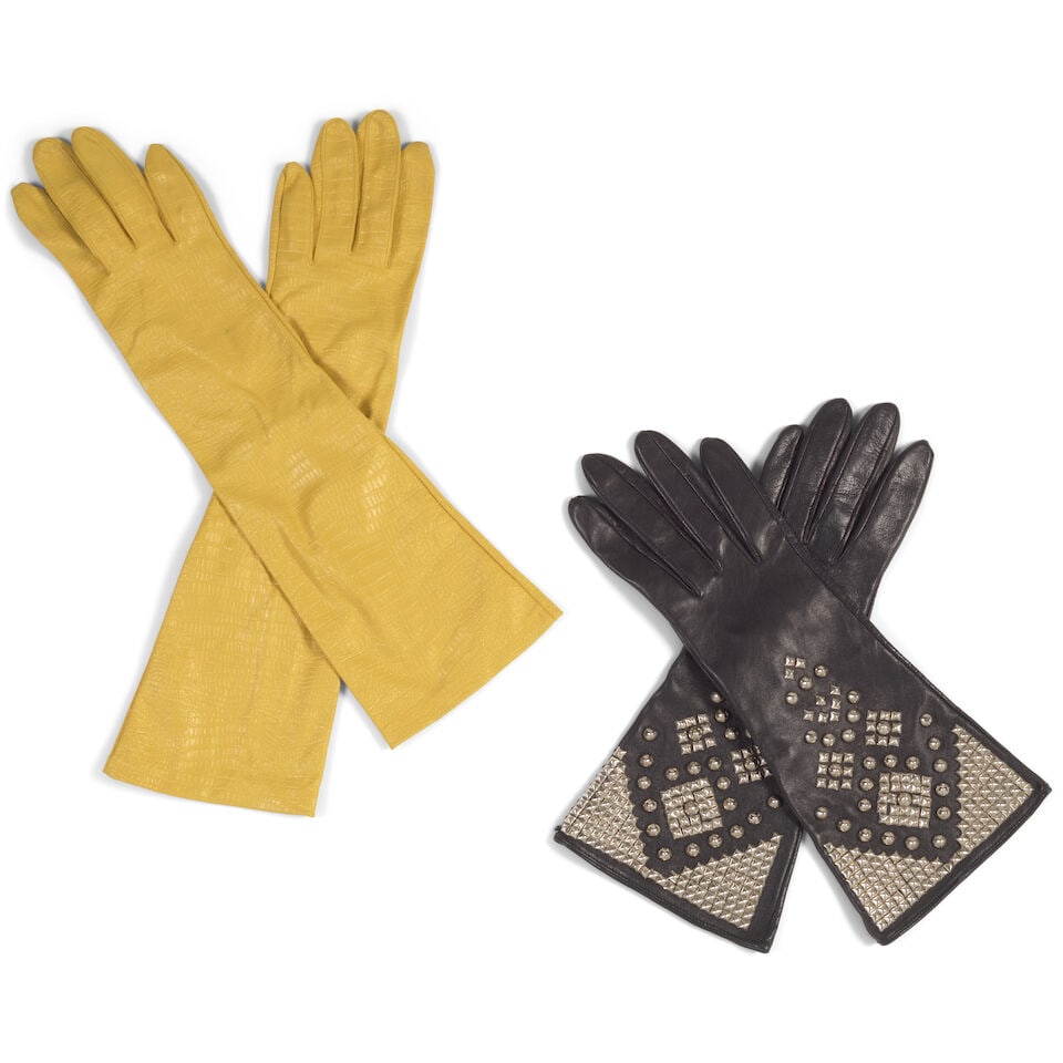 TWO PAIRS OF GLOVES: TWO PAIRS OF GLOVES Comprising a pair of yellow nylon gloves, marked size B and a pair of silver studded black leather gloves. lengths 8 3/4in to 15 3/4in This lot is subject to the following lot