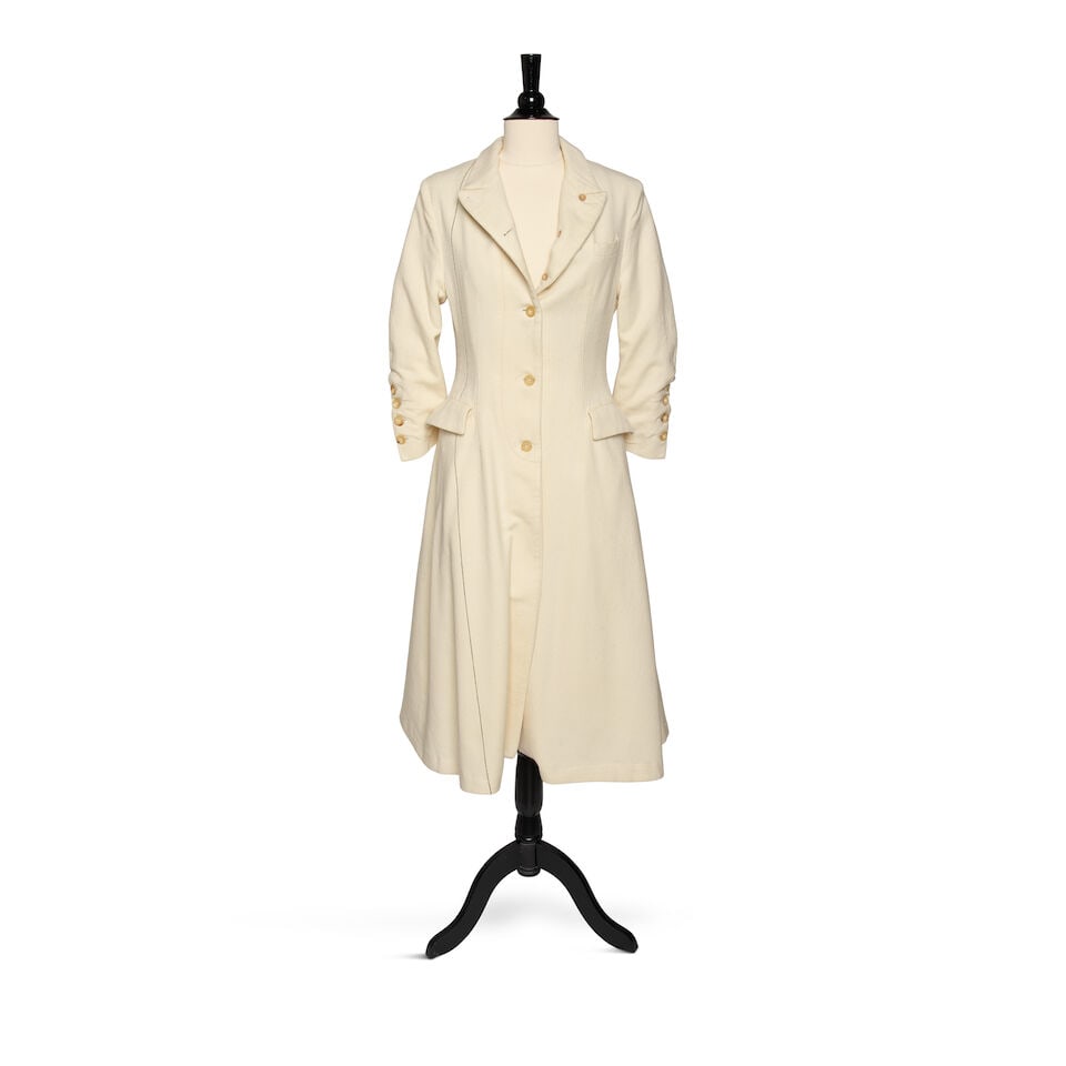 A PAUL HARNDEN SHOEMAKERS WHITE WOOL BUTTON-DOWN COLLARED COAT: A PAUL HARNDEN SHOEMAKERS WHITE WOOL BUTTON-DOWN COLLARED COAT Marked size M. Footnotes: Worn for her S. Harris Elements textile line photoshoot, 2022. Photographs featured in Architectural Digest