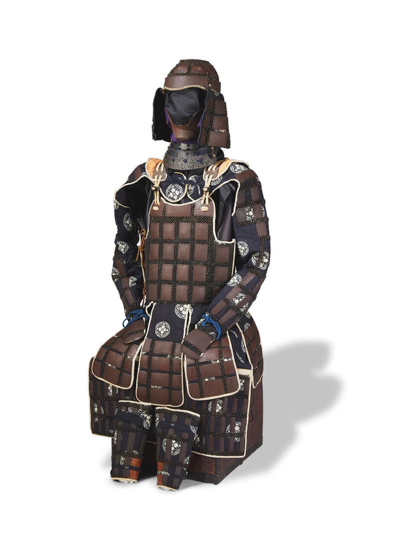A KARUTAGANE TATAMI GUSOKU (A FOLDING CHAIN MAIL SUIT OF ARMOR) Edo period (1615-1868), 19th cen...: A KARUTAGANE TATAMI GUSOKU (A FOLDING CHAIN MAIL SUIT OF ARMOR) Edo period (1615-1868), 19th century Constructed of chain mail and rectangular iron plates lacquered russet-brown, sewn onto a fabric ba