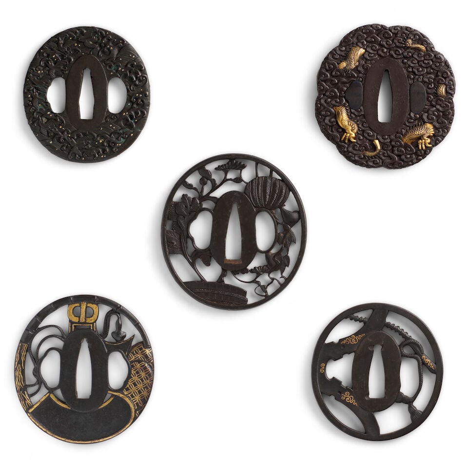 FOUR IRON TSUBA (HAND GUARDS) AND ONE SHIBUICHI TSUBA Edo period (1615-1868) or Meiji era (1868-...: FOUR IRON TSUBA (HAND GUARDS) AND ONE SHIBUICHI TSUBA Edo period (1615-1868) or Meiji era (1868-1912), 19th century Comprising an oval shibuichi tsuba chiseled in relief and with gold details depictin