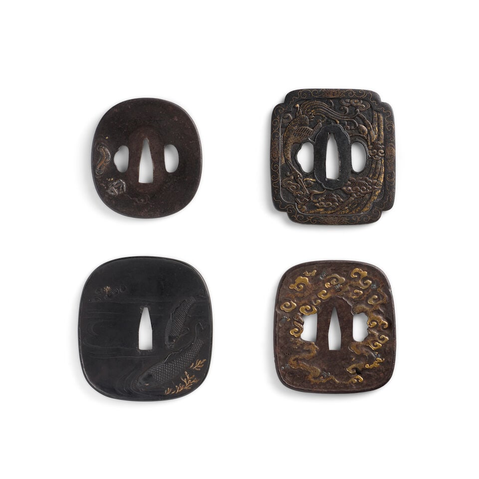 FOUR INLAID-IRON TSUBA (HAND GUARDS) Edo period (1615-1868), 18th/19th century (4): FOUR INLAID-IRON TSUBA (HAND GUARDS) Edo period (1615-1868), 18th/19th century Comprising a rounded rectangular tsuchimeji tsuba chiseled and inlaid in relief in silver and gold with a dragon in cloud