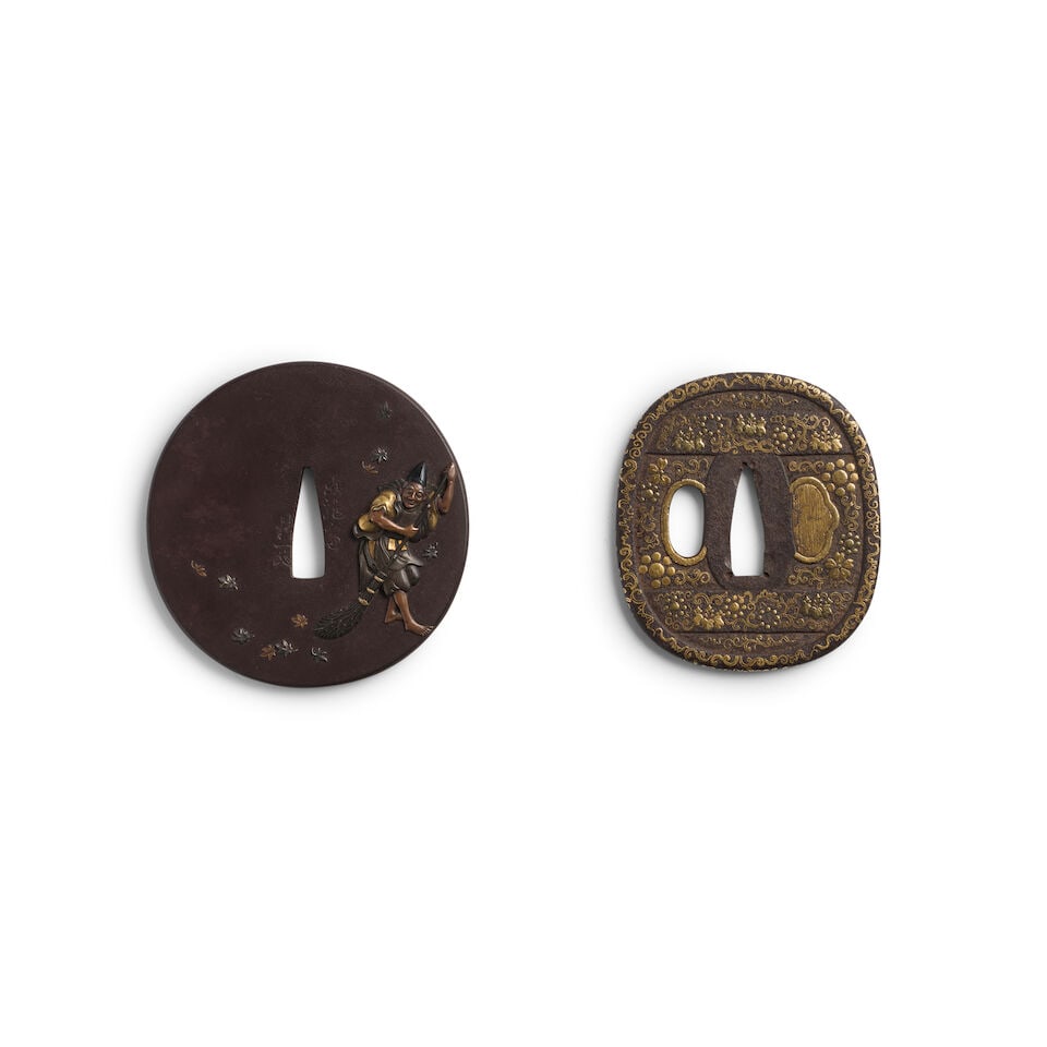 TWO INLAID-IRON TSUBA (HAND GUARDS) Edo period (1615-1868), 19th century (2): TWO INLAID-IRON TSUBA (HAND GUARDS) Edo period (1615-1868), 19th century The first circular, decorated with a man sweeping maple leaves, the reverse with the tree from which they have fallen, all chis