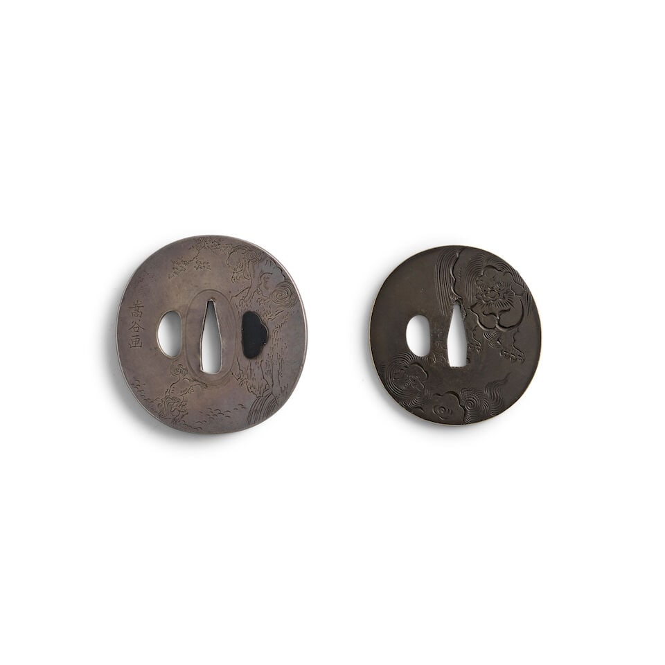 TWO YOKOYA-SCHOOL TSUBA (HAND GUARDS) Edo period (1615-1868), 19th century (2): TWO YOKOYA-SCHOOL TSUBA (HAND GUARDS) Edo period (1615-1868), 19th century The first a heavy, oval silver migakiji tsuba chiseled in kebori with shishi (mythical Chinese lions), inscribed Sūya ga