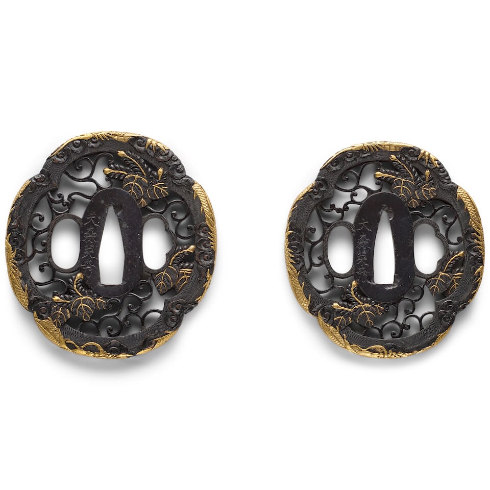 ŌMORI LINEAGE A Shakudō (Gold-Copper Alloy) Daisho Pair of Tsuba (Handguards) Edo per...: ŌMORI LINEAGE A Shakudō (Gold-Copper Alloy) Daisho Pair of Tsuba (Handguards) Edo period (1615-868), 18th/19th century Of mokkō form chiseled and pierced with paulownia blossoms and vin