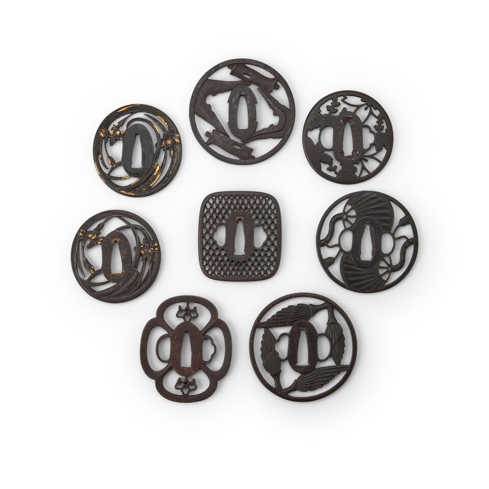 A GROUP OF EIGHT VARIOUS IRON TSUBA Edo period (1615-1868), 18th/19th century (8): A GROUP OF EIGHT VARIOUS IRON TSUBA Edo period (1615-1868), 18th/19th century Comprising a sukashi tsuba with orchids decorated with gold overlays, signed Eishu no ju Tsunemasa; a nearly identical suk