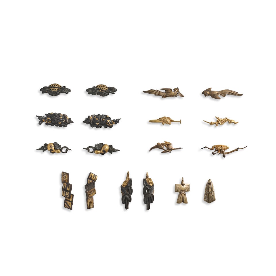SEVEN PAIRS OF MENUKI (HILT GRIPS) AND FOUR SINGLE MENUKI Edo period (1615-1868), 18th/19th cent...: SEVEN PAIRS OF MENUKI (HILT GRIPS) AND FOUR SINGLE MENUKI Edo period (1615-1868), 18th/19th century Comprising a shakudō and gold pair, each in the form of a stream, a hishaku (dipper), and a