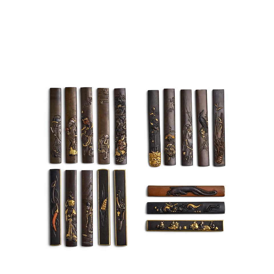 18 MIXED-METAL KOZUKA (KNIFE HANDLES) Edo period (1615-1868), 18th/19th century (18): 18 MIXED-METAL KOZUKA (KNIFE HANDLES) Edo period (1615-1868), 18th/19th century Comprising a shibuichi migakiji kozuka chiseled in shishiaibori and relief and with details in gold, shakudō, and c