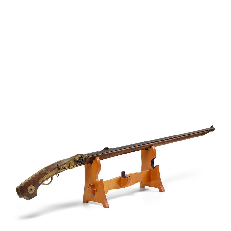 A MATCHLOCK GUN Edo period (1615-1868), 18th/19th century (2): A MATCHLOCK GUN Edo period (1615-1868), 18th/19th century The octagonal iron barrel set into a solid wood stock and decorated below the sites with cherry blossoms in silver overlay, the muzzle banded 