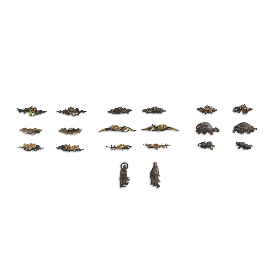 TEN PAIRS OF MENUKI (HILT GRIPS) Edo period (1615-1868), 18th/19th century (20): TEN PAIRS OF MENUKI (HILT GRIPS) Edo period (1615-1868), 18th/19th century Comprising a shakudō and gold pair, respectively in the form of the character tora (tiger) on a plum branch and the char