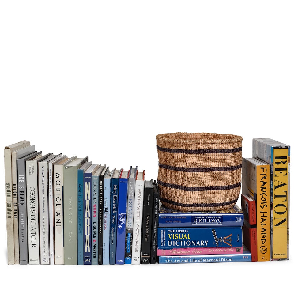 DIANE KEATON: A CURATED SELECTION OF BOOKS AND A WOVEN BASKET: DIANE KEATON: A CURATED SELECTION OF BOOKS AND A WOVEN BASKET Including Ice is Black by Laurent Baheux inscribed JUDGE AND ANN / MERRY CHRISTMAS / di, Nothing Personal by Avedon Baldwin with the