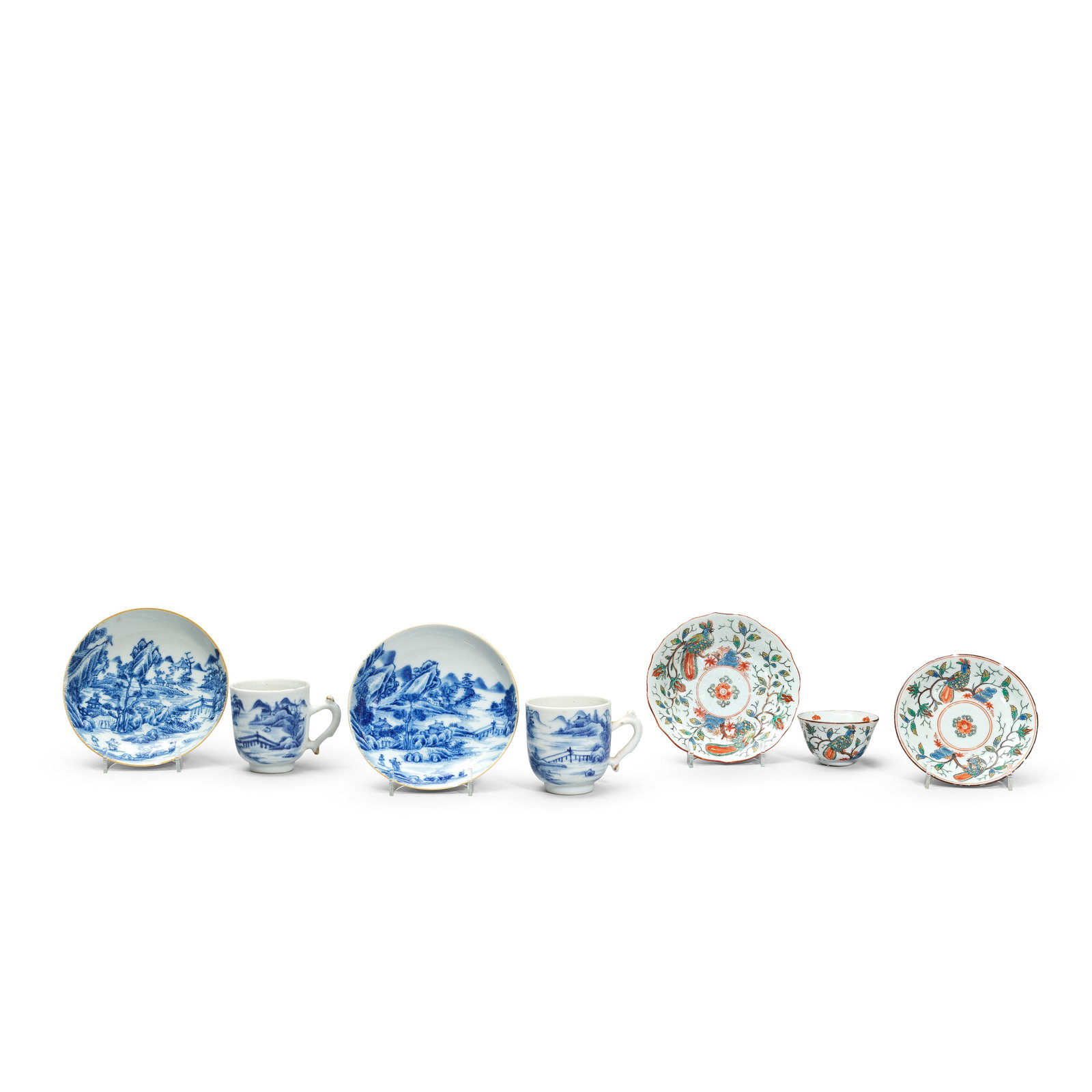 A PAIR OF BLUE AND WHITE CUPS AND SAUCERS, A DUTCH DECORATED CUP AND TWO SAUCERS 18th century (7): A PAIR OF BLUE AND WHITE CUPS AND SAUCERS, A DUTCH DECORATED CUP AND TWO SAUCERS 18th century Comprising: a pair of blue and white cups and saucers decorated to the exterior with figures in mountainou