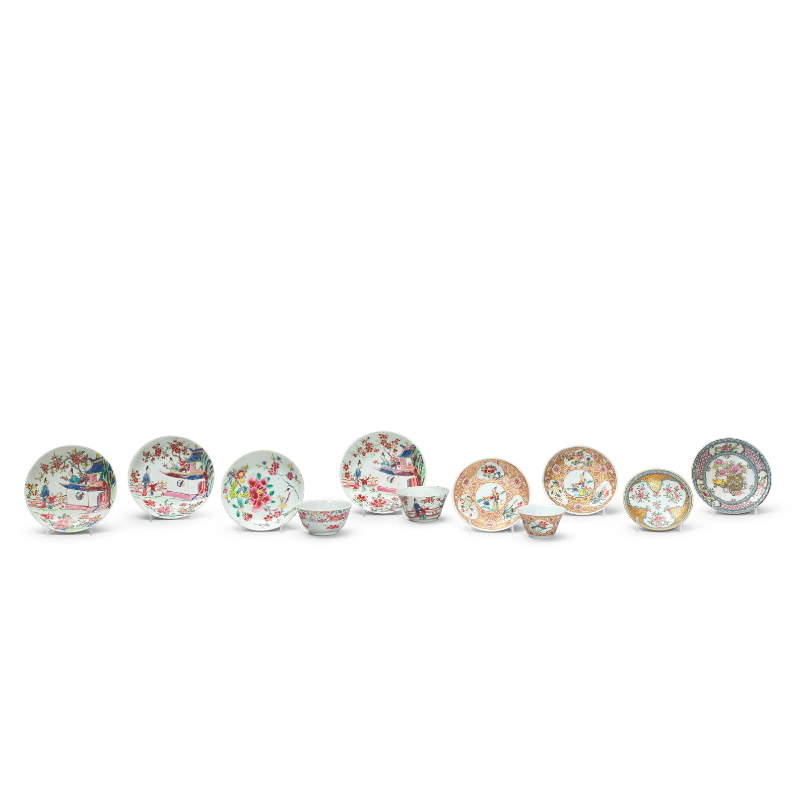 A GROUP OF FAMILLE ROSE EXPORT TEA BOWLS AND SAUCERS Yongzheng (11): A GROUP OF FAMILLE ROSE EXPORT TEA BOWLS AND SAUCERS Yongzheng Comprising: three tea bowls and a saucer en-suite decorated with ladies and a boy in a flowering pavilion garden; a tea bowl and two sauc