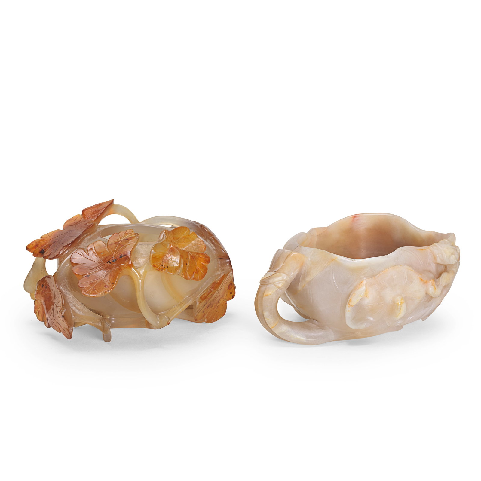 A JADE 'LOTUS' BRUSHWASHER AND AN AGATE WATERPOT Late Qing Dynasty (4): A JADE 'LOTUS' BRUSHWASHER AND AN AGATE WATERPOT Late Qing Dynasty The jade washer modelled as an unfurled lotus flower with gathered stems forming the handle and issuing a further lotus flower, pod a