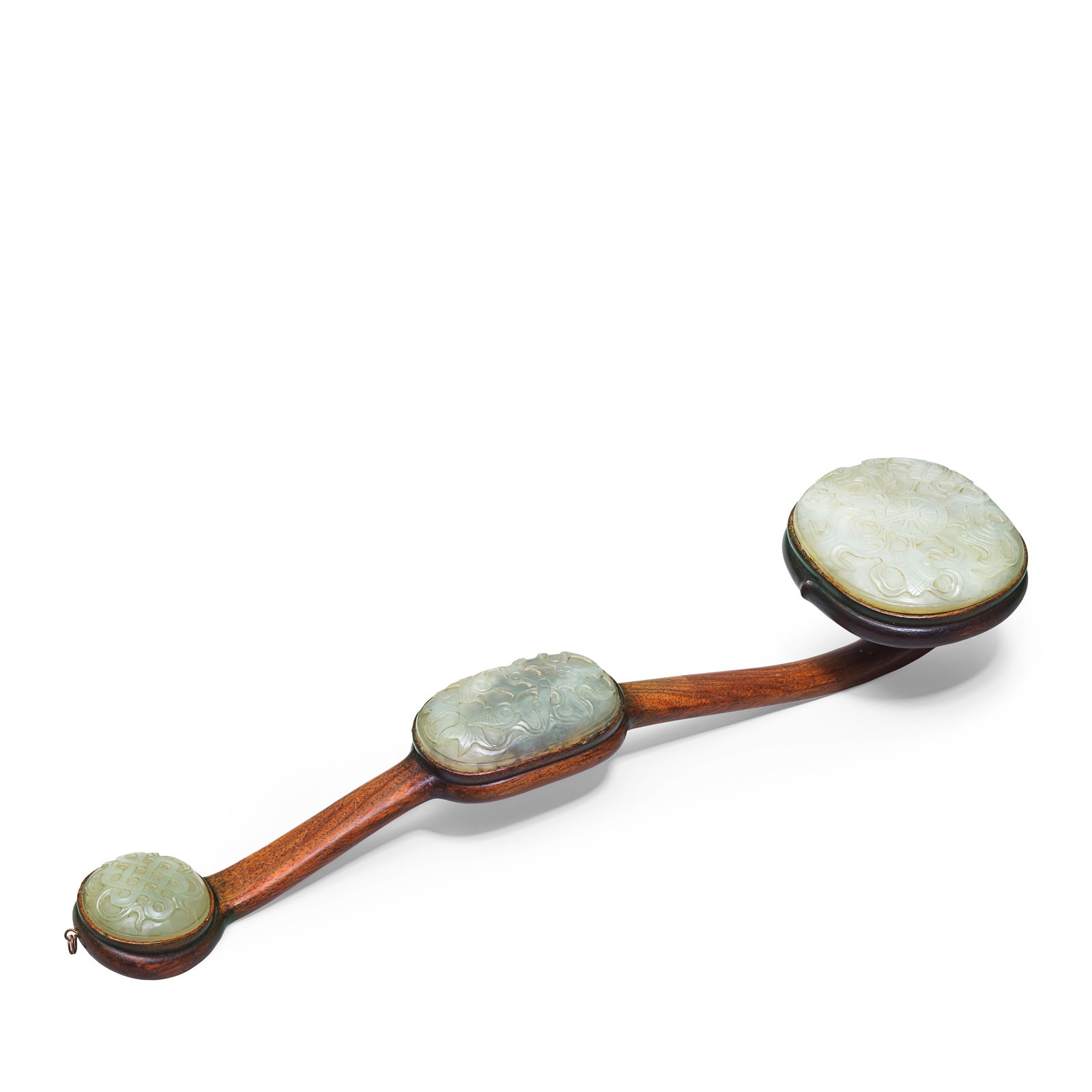 A JADE-INSET RUYI SCEPTRE Late Qing Dynasty: A JADE-INSET RUYI SCEPTRE Late Qing Dynasty The hongmu shaft set with circular jade panels to the ends and a further oval panel to the mid-section, carved with Buddhist emblems. 51cm (20 1/8in) long. 