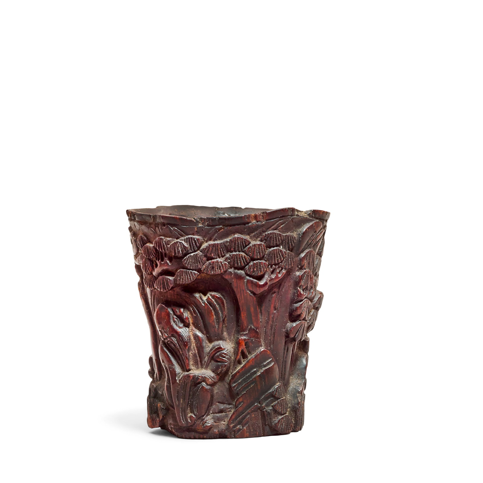 A CHENXIANGMU CUP Qing Dynasty: A CHENXIANGMU CUP Qing Dynasty Carved in high relief to depict Shoulao beneath pine trees against a rocky mountainside. 5cm (2in) high, 32g. Footnotes: 清 沉香木仙人