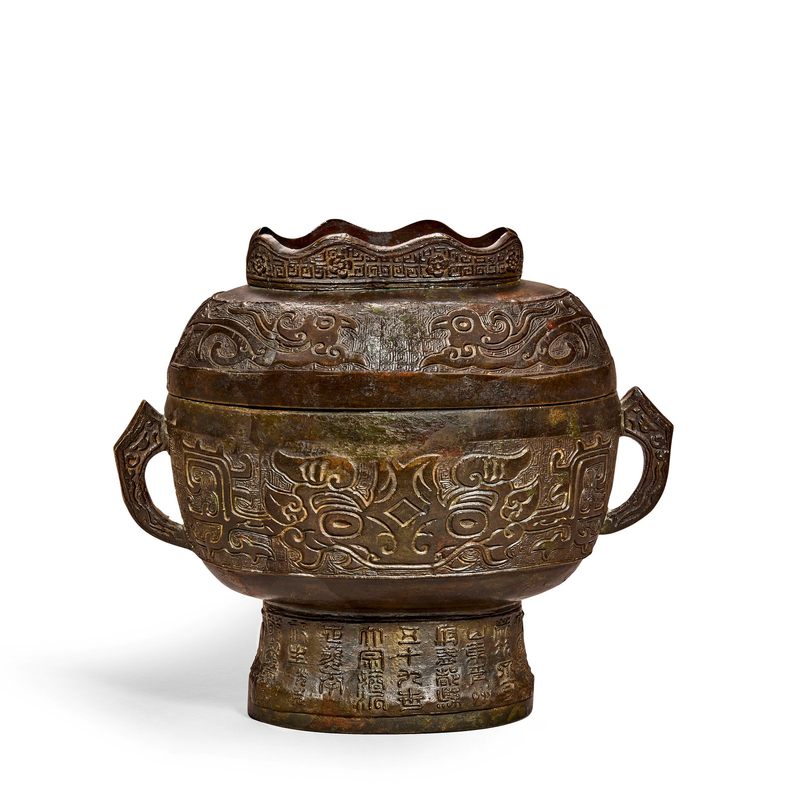 AN ARCHAISTIC BRONZE RITUAL FOOD VESSEL AND COVER, GUI Ming Dynasty, dated Dinghai year of Yongl...: AN ARCHAISTIC BRONZE RITUAL FOOD VESSEL AND COVER, GUI Ming Dynasty, dated Dinghai year of Yongle period, corresponding to 1407 Of oval form, set with a pair of shaped loop handles, cast in low relief