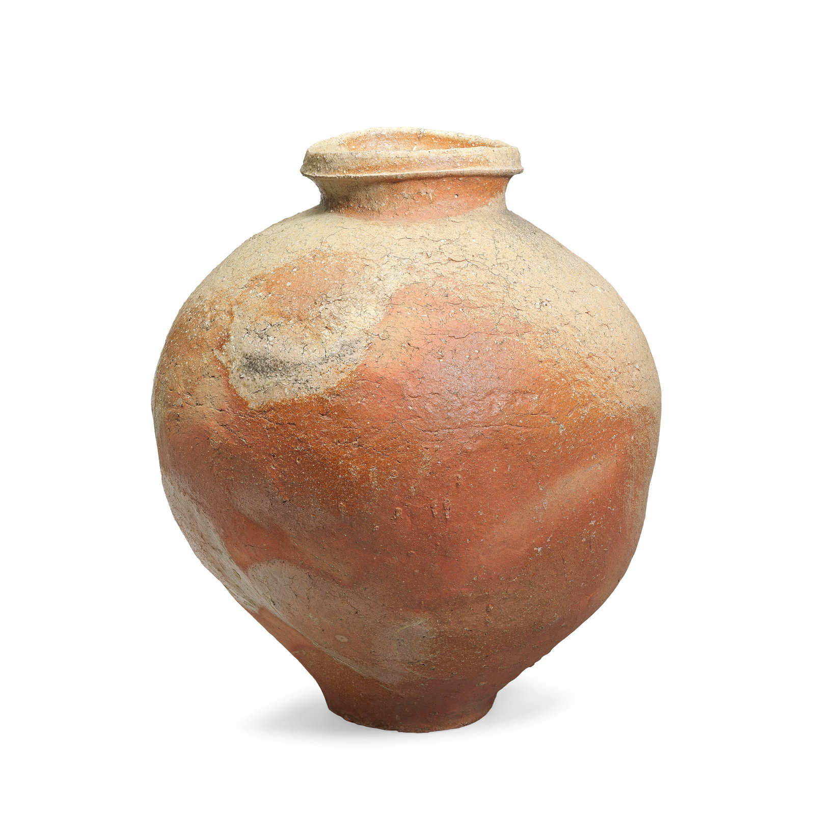 A LARGE STONEWARE STORAGE JAR, SHIGARAKI WARE Muromachi period, 15th century: A LARGE STONEWARE STORAGE JAR, SHIGARAKI WARE Muromachi period, 15th century The thickly potted vessel with a wide rounded body tapering to a narrow foot, the iron rich russet hued body liberally appl
